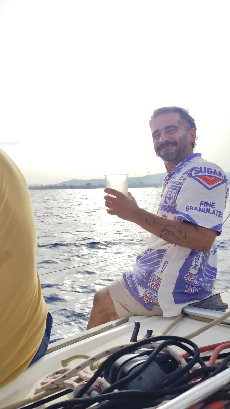 A guest enjoying a drink on deck