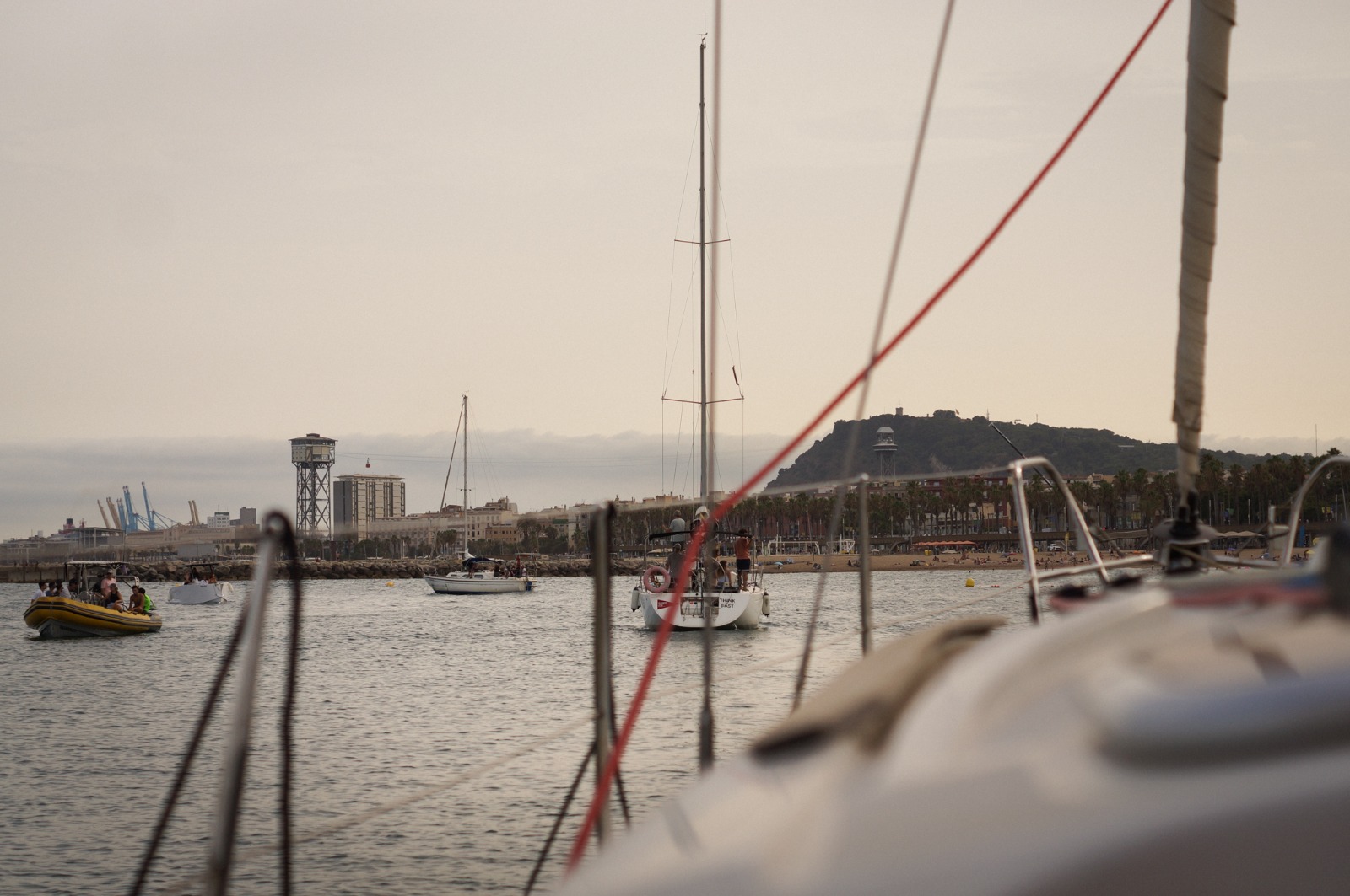 Sailing out of Port Olímpic at sunset