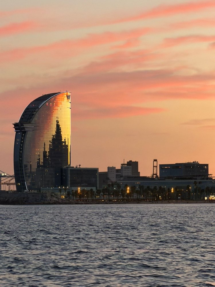Barcelona's W Hotel lit up gold at sunset, Edition 02